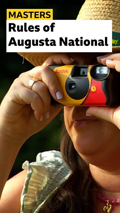 lady takes photo using disposable camera