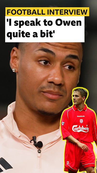 Ollie Watkins raises his eyebrows at a cut out of Michael Owen.