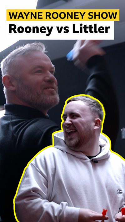 Luke Littler laughs at Wayne Rooney throwing a dart