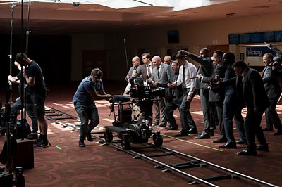 Behind the Scenes on Mint - Eddie (GORDON BROWN), Dylan (SAM RILEY), Sam (NEIL LEIPER), supporting artists (Photo credit: Credit: House/Fearless Minds/BBC/Sanne Gault)