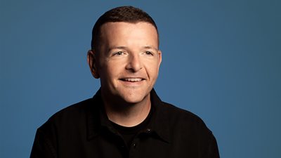 Headshot of Kevin Bridges. 
