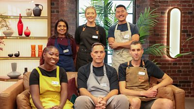 The six MasterChef 2026 heat 1 contestants sit and stand behind a brown couch in the MasterChef studio