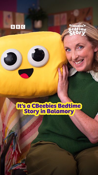 Julia Nimmo poses alongside a CBeebies cushion for Bedtime Story.