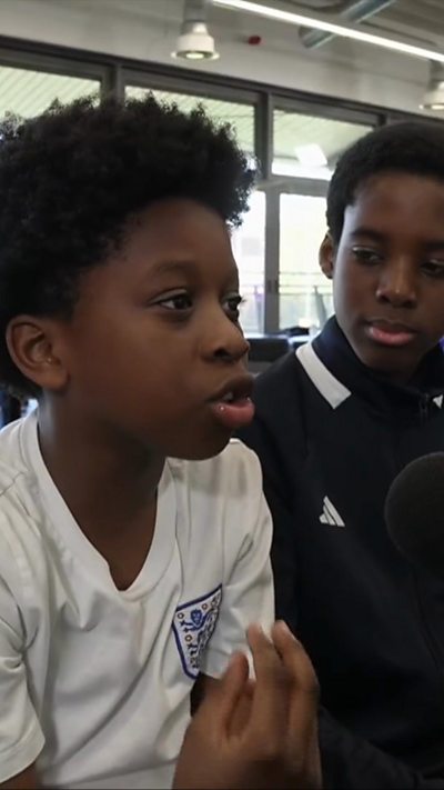 Child speaking into a microphone