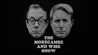 Black and white title card for The Morecambe and Wise Show, featuring photos of the faces of Morecambe and Wise above the title.