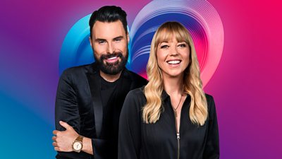 Rylan Clark and Sara Cox standing in front of a multi-coloured background