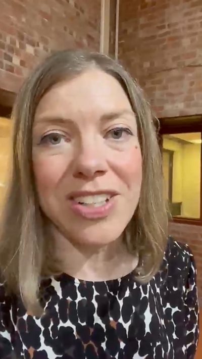 Reporter Claire Hamilton has long blonde hair and talks directly into the camera