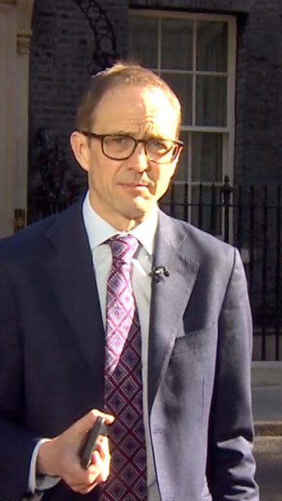 Chris Mason in a suit outside no 10 Downing Street.