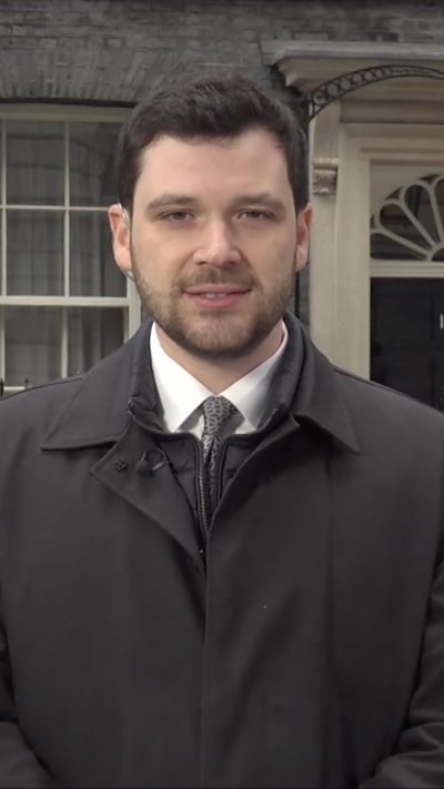 Zeffman in black on Downing Street