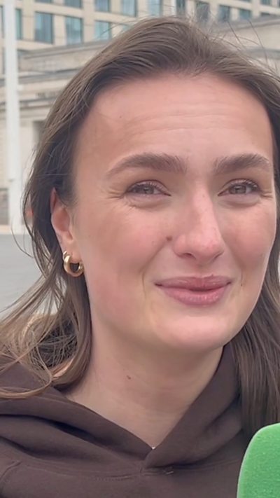 Woman speaks to the camera