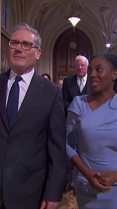 Badenoch and Starmer walking togethor in Parliament