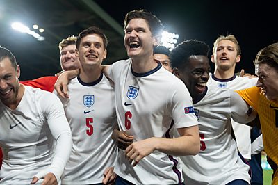 Harry Maguire (ADAM HUGILL);Bukayo Saka (ABDUL SESSAY);Harry Kane (WILL ANTENBRING);Jordan Pickford (JOSH BARROW) in Dear England (image credit: BBC/Left Bank Photographer: Justin Downing)