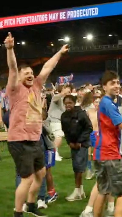 Palace fans celebrate on pitch after first European trophy