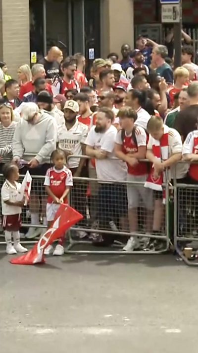 Aresnal fans behind a barrier