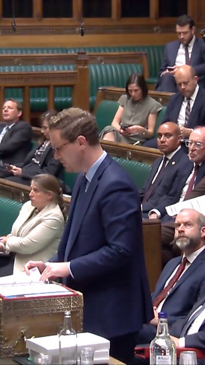Darren Jones wears a blue suit at the despatch box