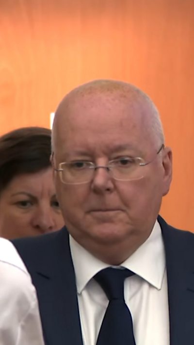 Man in dark tie and suit