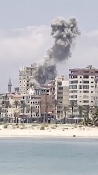 Smoke billows from a building after a missile strike