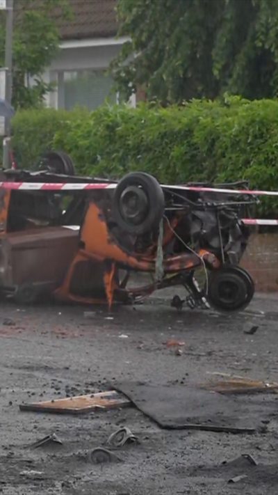 Car upside down in road