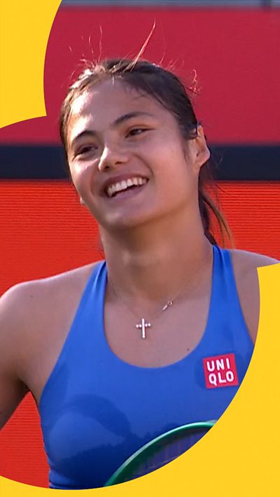 Emma Raducanu smiles on court