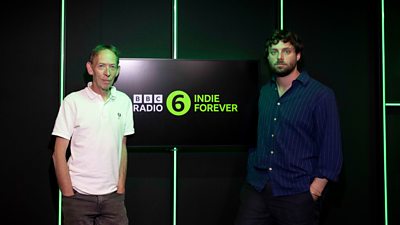 Steve Lamacq and Felix White stood next to a screen reading BBC Radio 6 Indie Forever