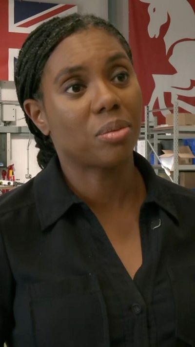 A woman in a black shirt.