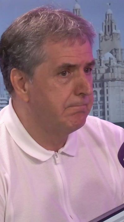 Steve Rotheram with picture of Liver buildings behind him
