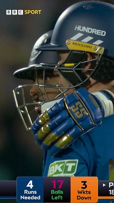 Nicholas Pooran and Curran embrace after securing victory