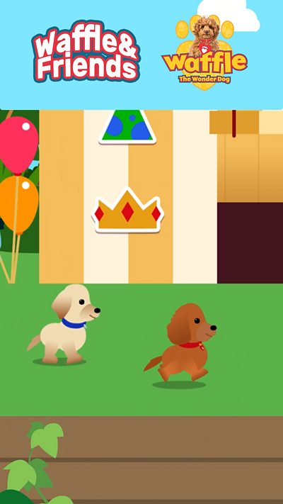 Waffle and Friends game still. Two dogs walk on grass.