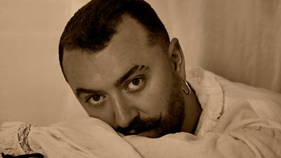 A headshot of Sam Smith