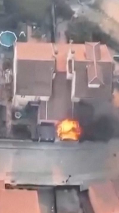 A house with a fire in the garden
