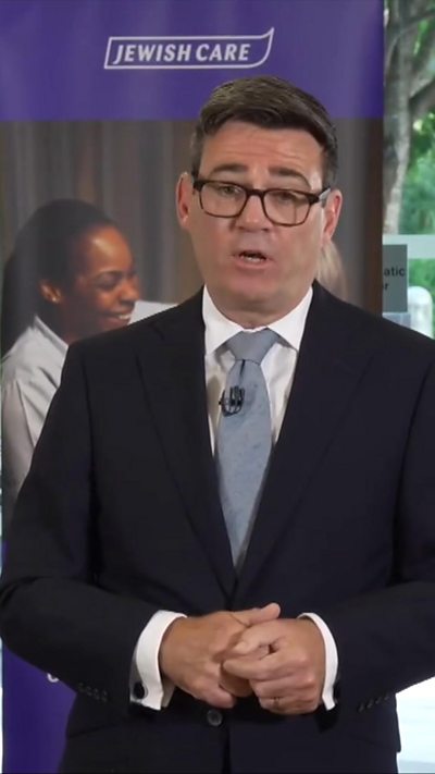 Vertical image of Burnham speaking