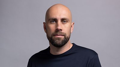 Headshot of Josh Baker. 
