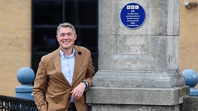 A plaque on a pillar indicating the location of the first transmitter of the BBC in Northern Ireland