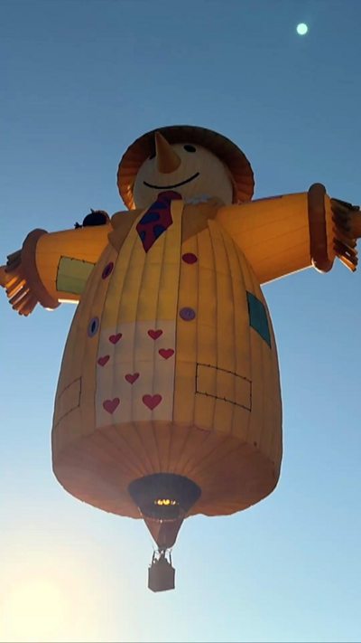 Scarecrow hot air balloon in the air of 2026