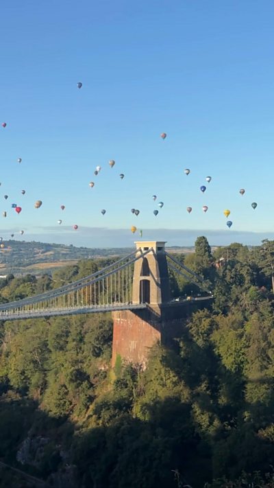Balloons over the Clifton Suspension Bridge in Bristol.