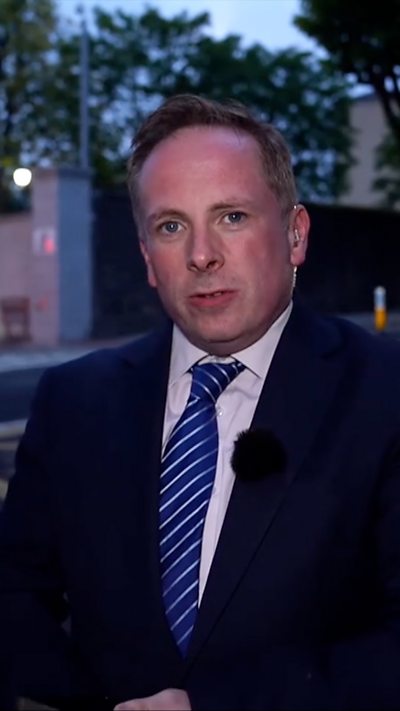 Man in a suit.