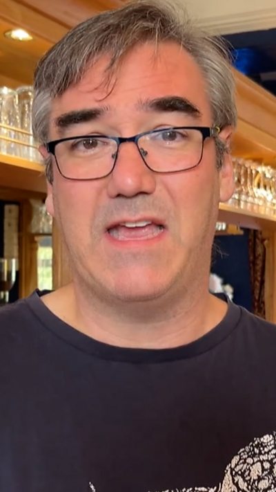 A man speaking to the camera