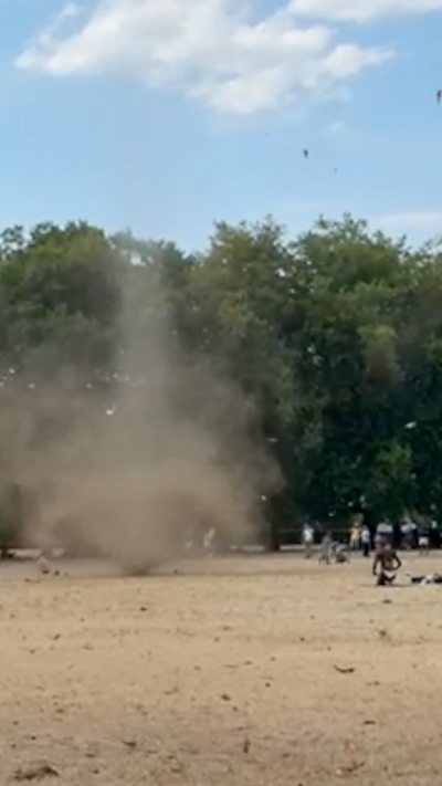 A mini tornado spinning through park