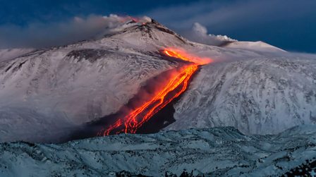Lava flowing down Mount Etna during an eruption.