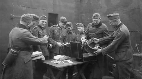 A bunker crew receives music instruments and sundry other items for leisure time activities during the Phoney War