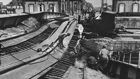 A photograph of a damaged German railway line. 