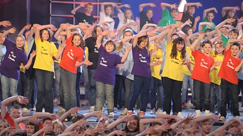 A group of children performing on a stage