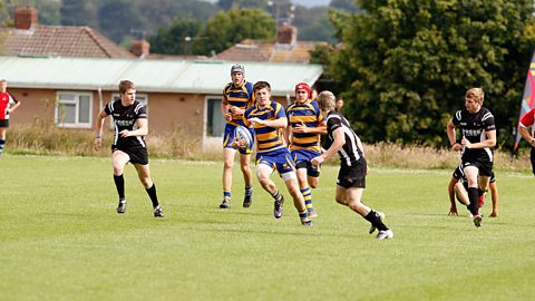 Boys playing rugby