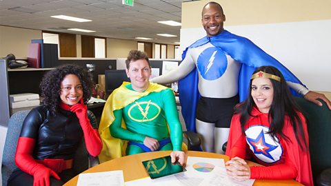 Portrait of office workers in fancy dress as superheroes