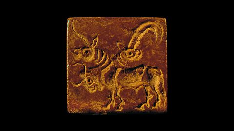 An Indus seal showing a three-headed animal