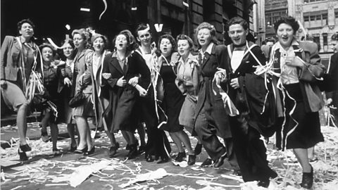 Revellers gathered with confetti and ribbon