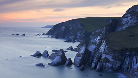 Slate sea stacks and cliffs near Westcombe Beach, South Devon, England