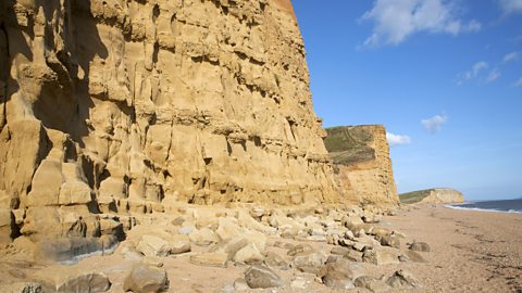 Sandstone cliffs and beach at West Bay, Bridport, Dorset, England