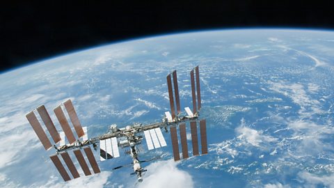 The International Space Station in orbit above the Earth.