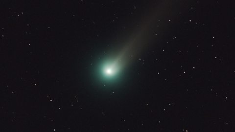 A glowing comet in the sky.